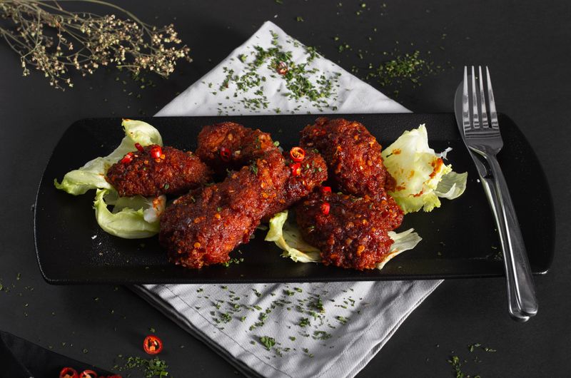 Garlic Parmesan chicken wings coated in herb butter